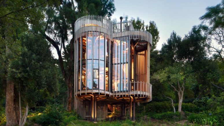 This unique house was made for a client who wanted a treehouse right in the forest and it's composed of several towers
