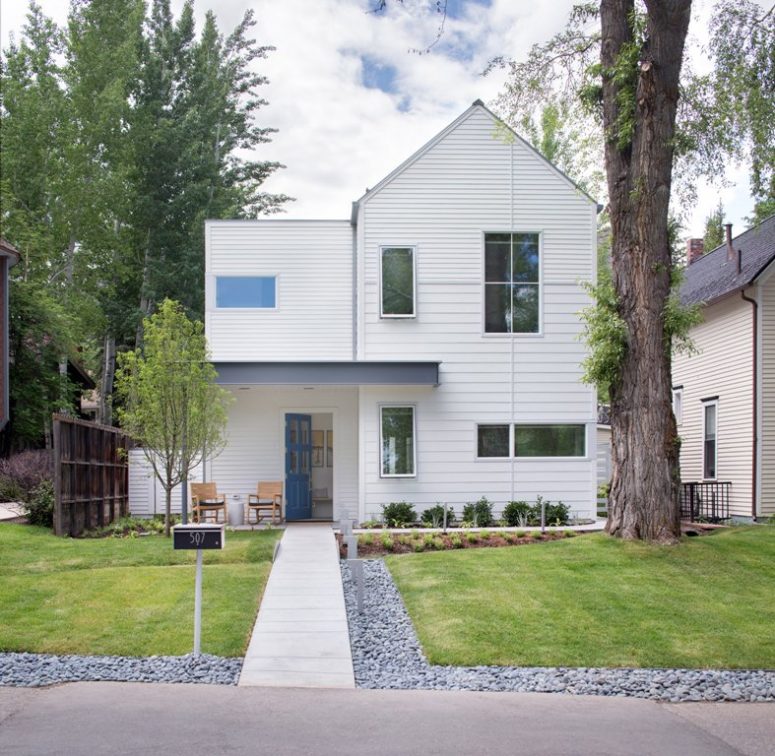 The house has perfect landscaping and is covered with white siding to give it a more modern look