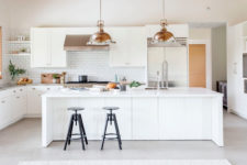 large, all-white kitchen island design