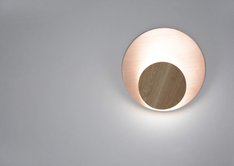 The circle can be in brushed copper or brass and the disk is only in solid wood of a contrasting shade