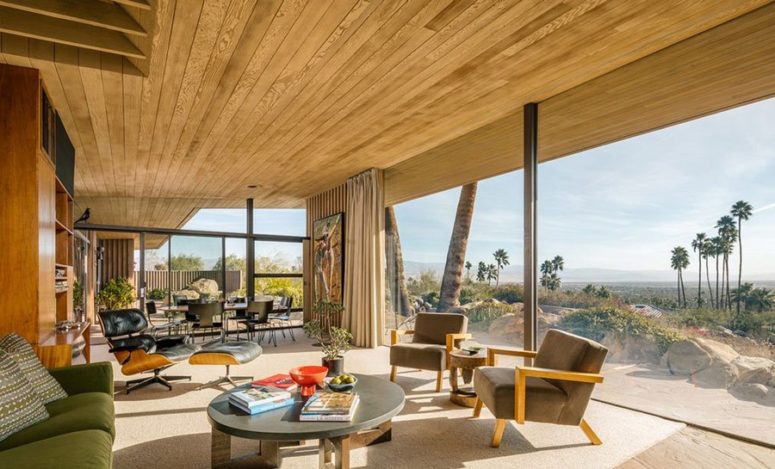 The stunning desert views are brought inside with a glazed wall, and they become a focal point of this interior