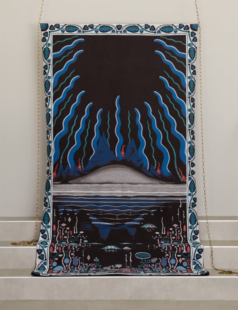 The tapestry is intended to be used as a rug over the sofa
