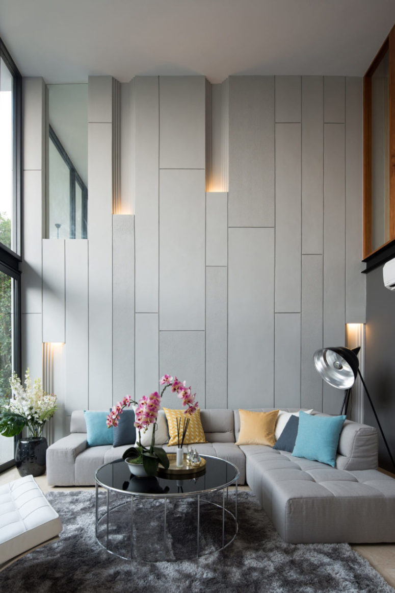 These off-white panels with light look super modern and unusual, this is a real focal point of the room