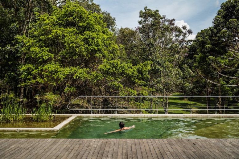 A pool is raised off the ground for better views over the surroundings