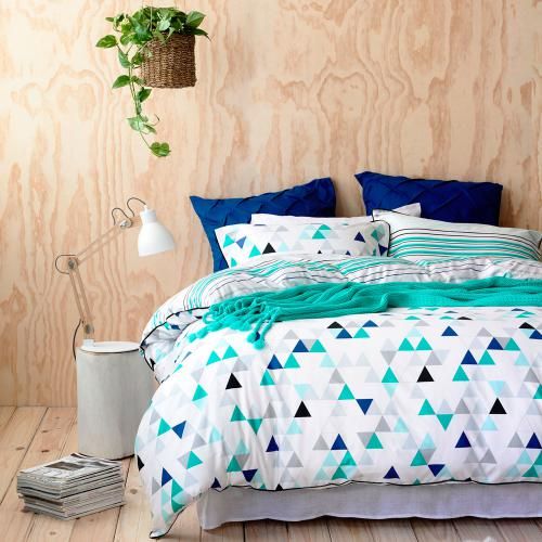 bold turquoise, blue, white and black bedding for a fresh touch in your bedroom