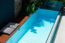 04 small narrow glass pool will make a modern statement in the tiniest backyard