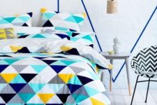 05 bold turquoise, navy, black, white and yellow tirangle bedding to spruce up your space