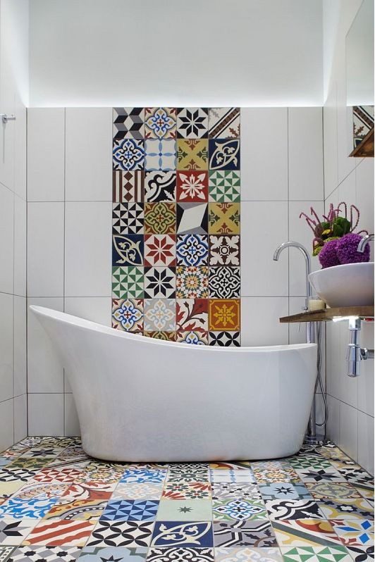 colorful mosaic tiles on the floor and a bold stripe on the wall
