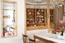 06 The cupboards are rustic and vintage ones, they display different dishes and cups in a cool way