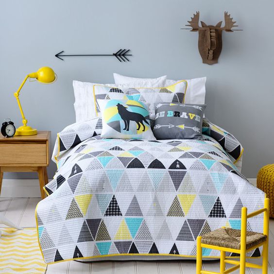 grey, turquoise, black and yellow pillows and a duvet for a modern feel