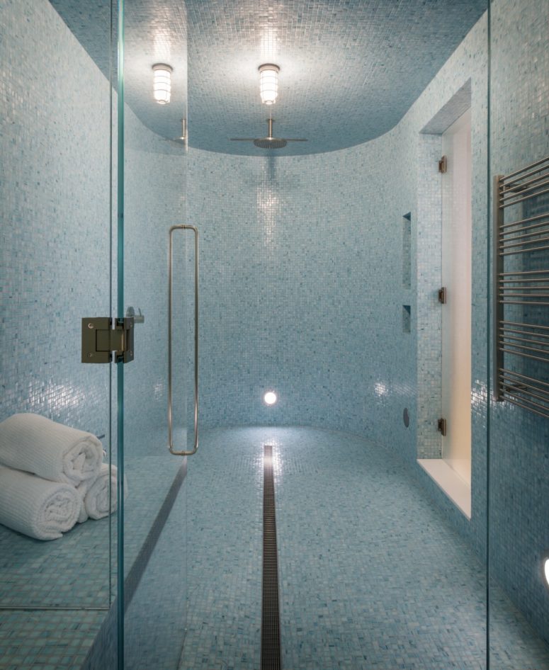 There's a home spa clad with small blue tiles, so gorgeous