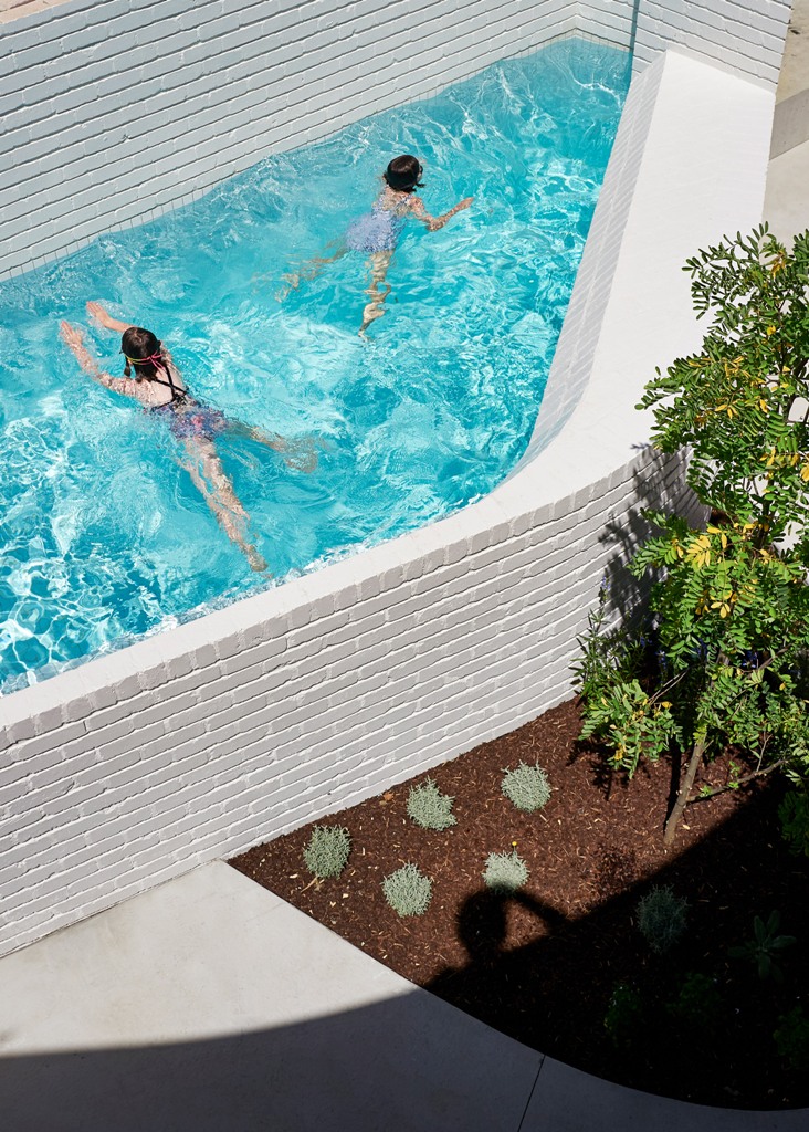 The pool is also clad with brick to fit the home decor style