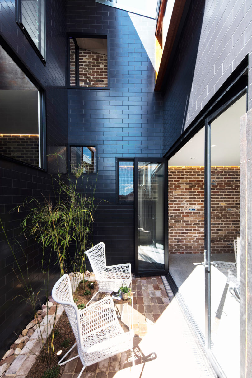 There's a small courtyard with greenery and chairs, it refreshes the kitchen