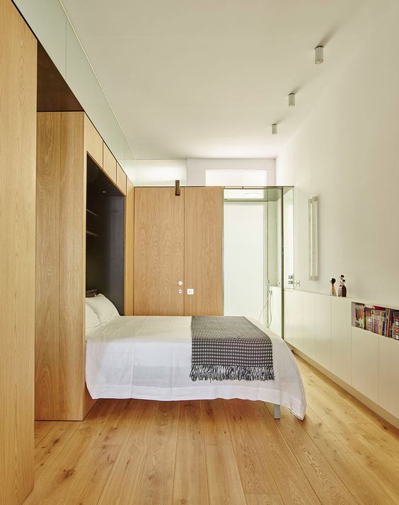 There's another bedroom with a folding bed, almost fully clad with oak wood for comfort