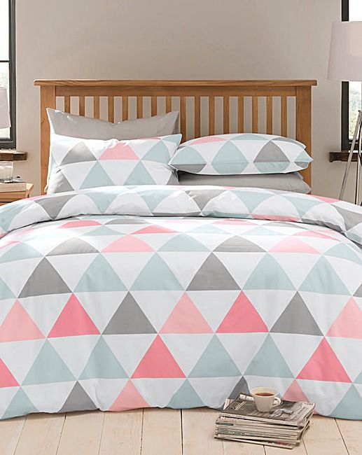 coral, grey and white bedding with a triangle print