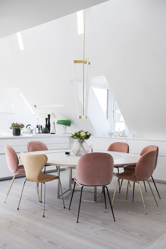 powder pink and beige chairs are ideal to hint that this space is feminine