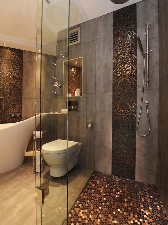 sparkling copper hexagon tiles accentuate the shower and niches