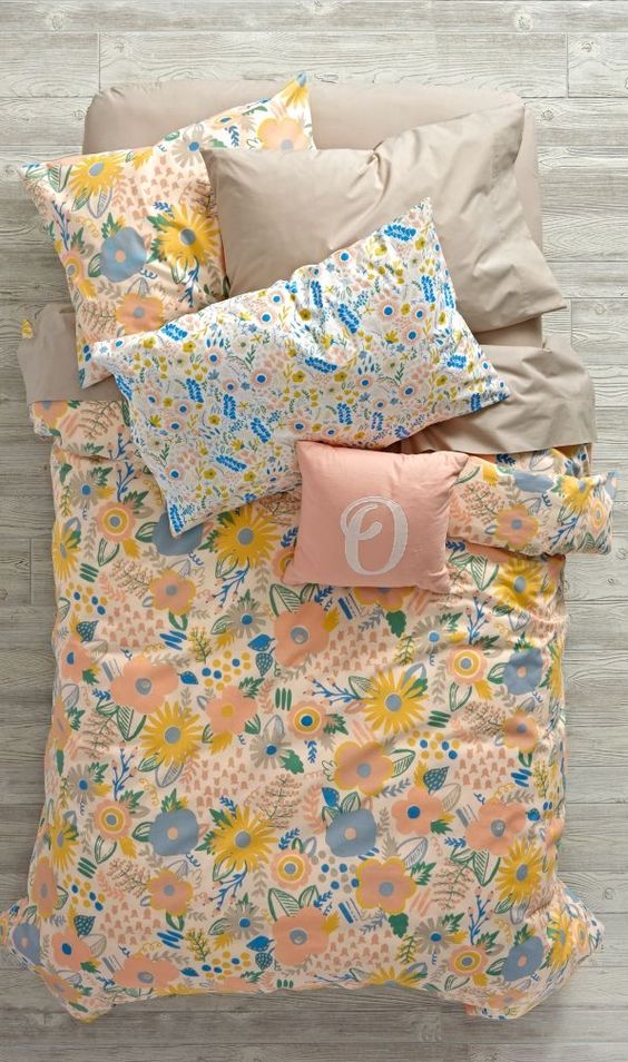 blush and beige bedding with blush, blue and yellow flowers for those who love pastels