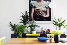 11 sunny yellow chairs contrast with navy pieces and create a cool mood