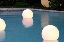 12 floating, waterproof LED globes for lighting up the pool, and you can swim with them