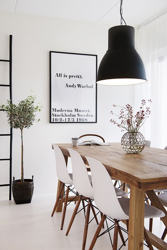 oversized black lamp makes a statement in this Scandinavian space