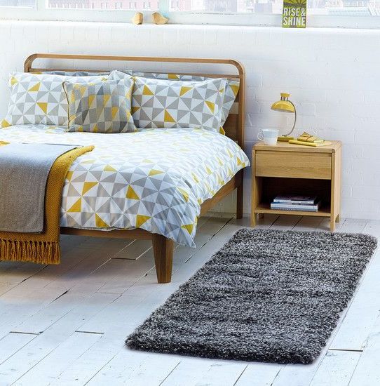 grey, white and mustard triangle print bedding for a Scandinavian space