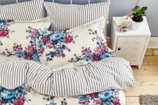 17 cute pink and blue bedding with a cream backdrop and striped pillows in the set