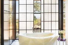 18 gorgeous faceted tub carved from white onyx is a wow-factor in this bathroom