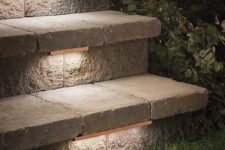19 low-profile contemporary stair lighting under treads of outdoor stone steps