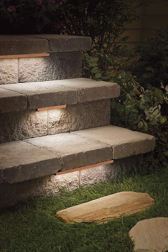 Low profile contemporary stair lighting under treads of outdoor stone steps