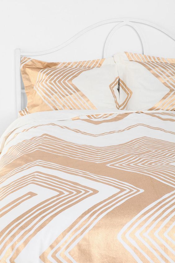 white and gold geometric large scale print bedding for a glam touch