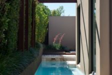 21 a very small backyard accomodates only a cool narrow pool for relaxing