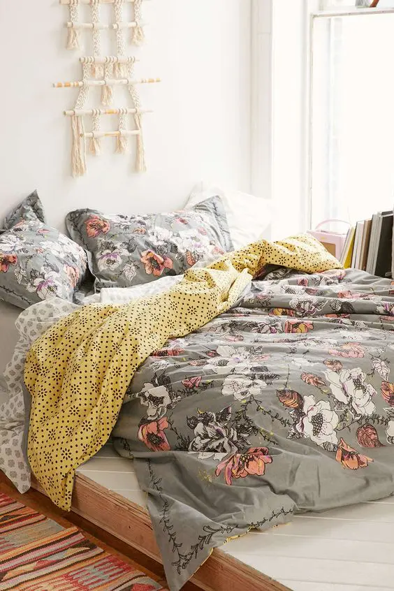 grey bedding with coral and white flowers