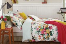 22 red and yellow floral bedding with accnet pillows and blankets in matching colors