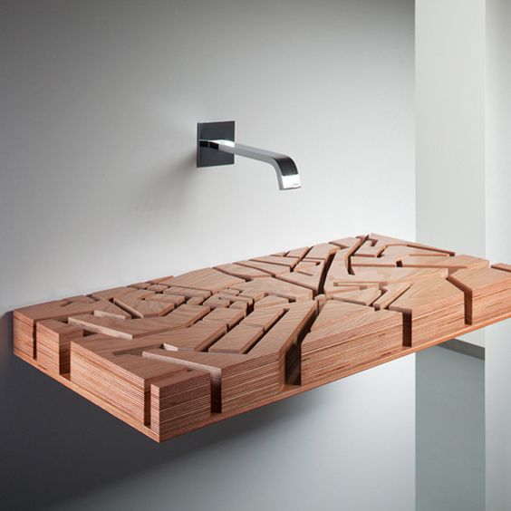 a wooden sink inspired by a map of London looks really unique