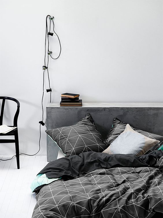 black graphic bedding with white prints for a masculine bedroom