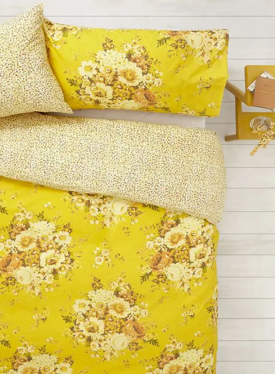 sunny yellow bedding with spotted lining and flowers in the same shades