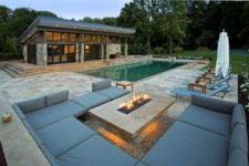 25 a modern lit fire pit is enough for a living zone