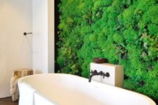 27 an indoor plant wall can become a focal point in your bathroom and make you feel taking a bath outside