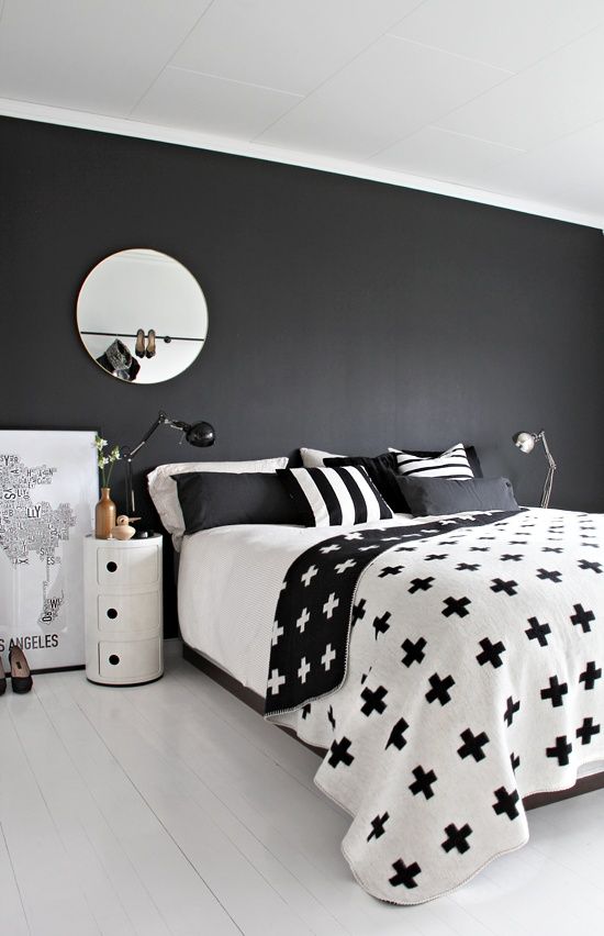 graphic black and white bedding with stripes and crosses for a minimalist space