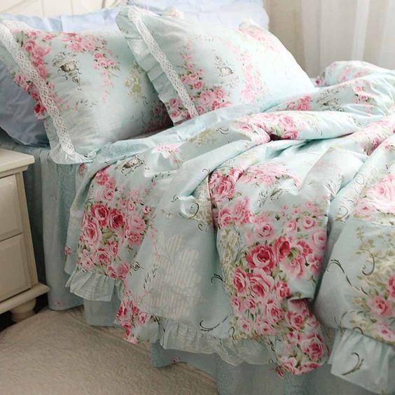 vintage-inspired blue and pink rose bedding with lace detailing