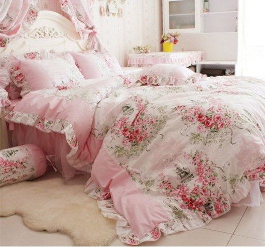 vintage-inspired pink bedding with pink flowers and greenery for a princess room