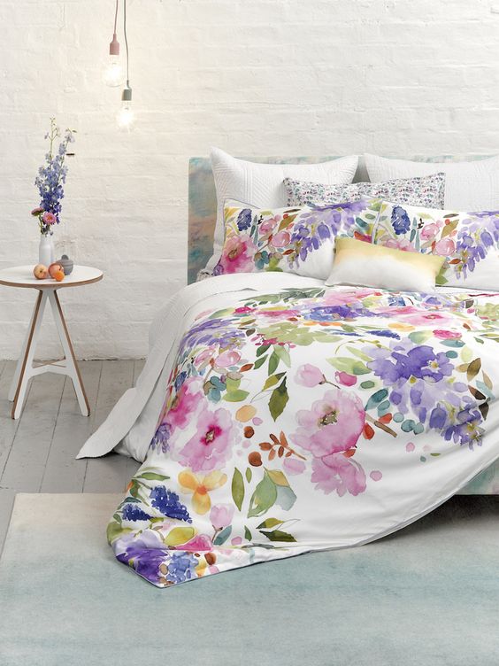 watercolor bedding in shades of pink, lilac, purple and green