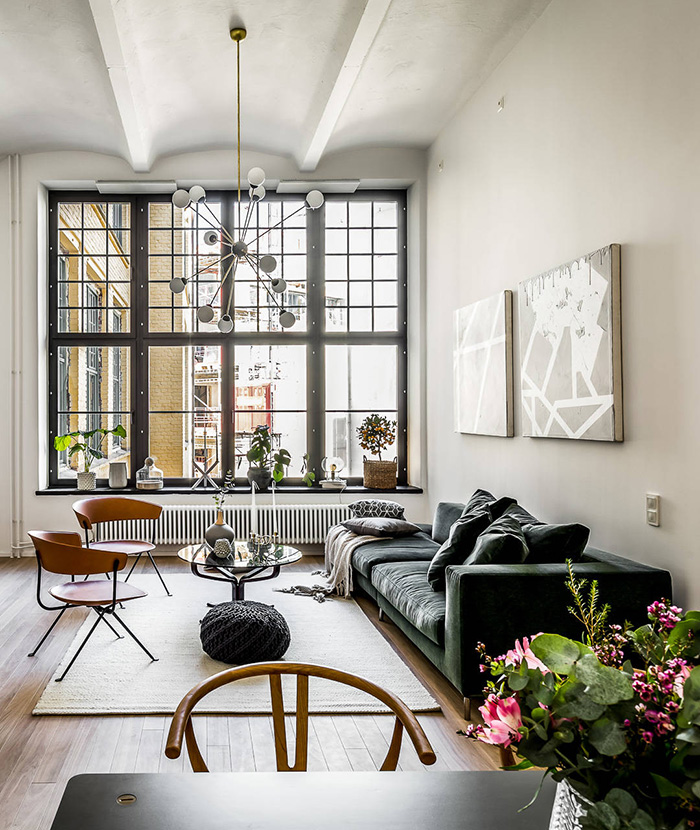 This Stockholm apartment is in a converted brewery but nothing reminds of its industrial factory as it's decorated in Scandinavian apartment
