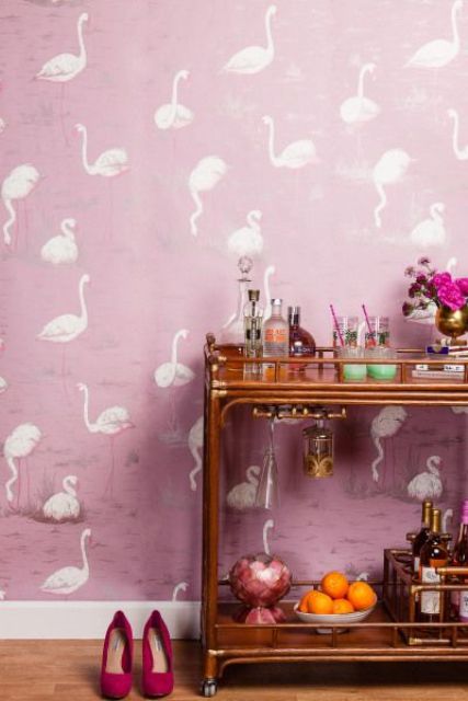 Pink wallpaper with a white flamingo print is another eye catchy solution for various spaces