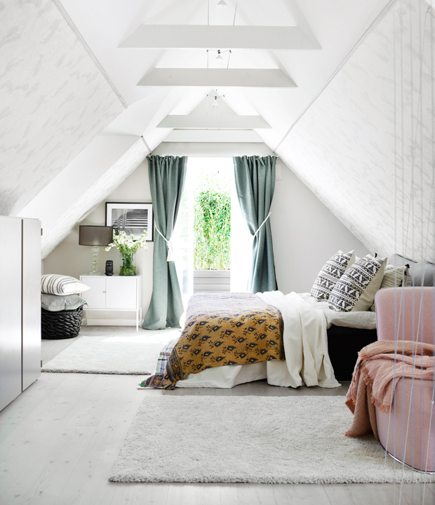 The master bedroom is an attic space, which is a great calming backdrop for bold and printed fabrics