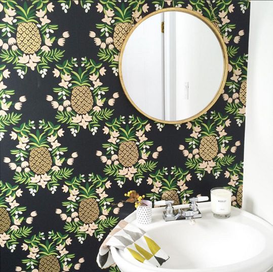black wallpaper with pineapple and floral prints