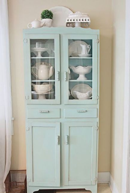 dusty blue cupboard with glass and usual compartments will accentuate any vintage space