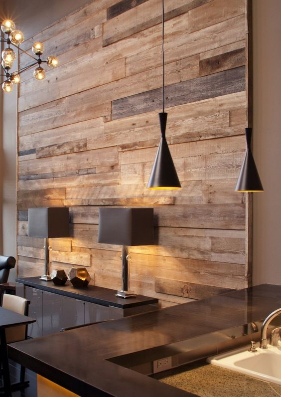 a reclaimed wood wall contrasts modern furniture and fixtures