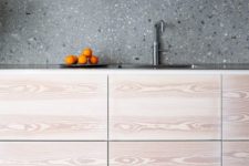 07 grey terrazzo kitchen backsplash contrasts the light colored cabinets